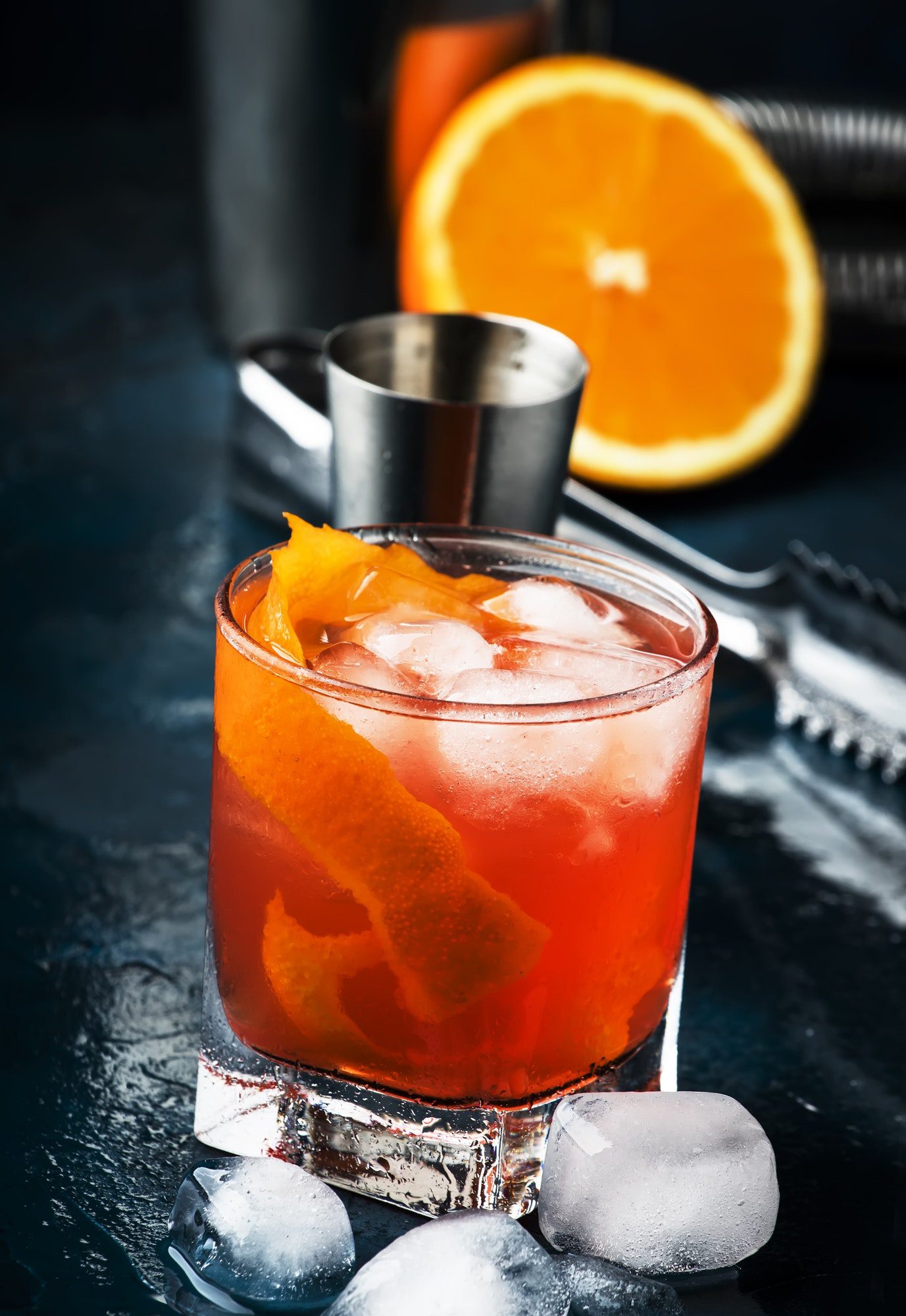 Garibaldi alcoholic cocktail with red bitter, orange juice, zest and ice